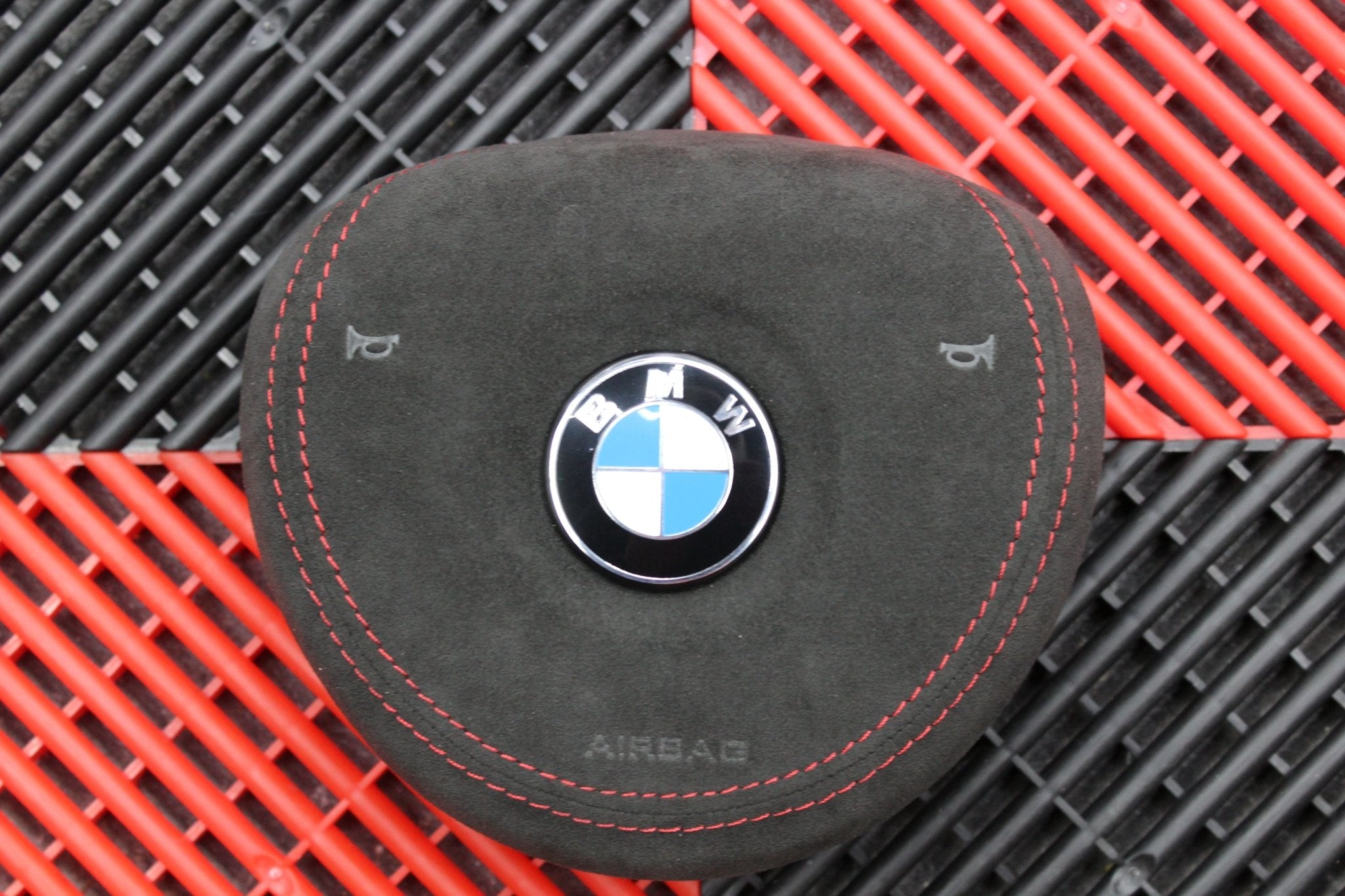 BMW Alcantara airbag cover with red stitching